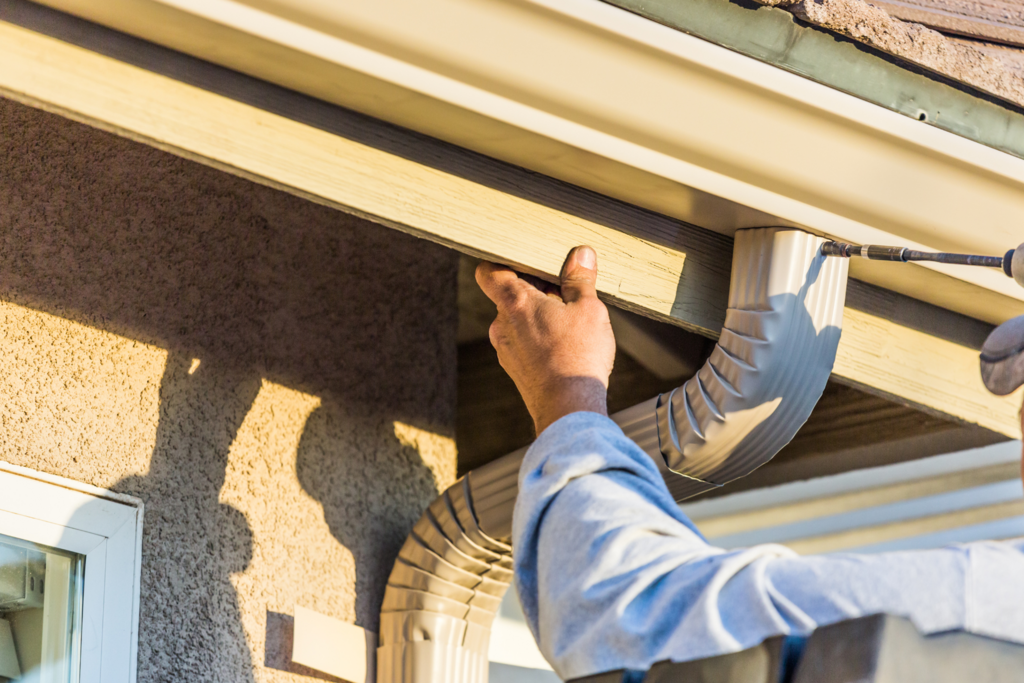 Man Installing Gutters